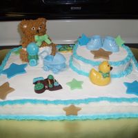 Baby Shower Baby shower cake with teddy bear cake on top and candy molds.