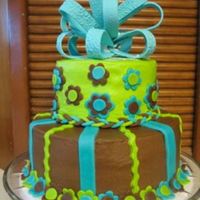 Img_1634.jpg Buttercream with mmf accents. This was my first tiered cake, mmf and bow. The bow looks horrible. I hung the loops to dry around a pvc pipe...
