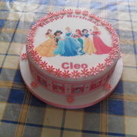 Princess Cake This is a sponge cake covered with fondant then decorated with edible prints and finished off with some small flowers that i made.