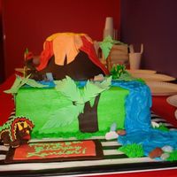 Dino Cake Buttercream with fondant accents. Volcano was rice krispie. Client took photo, so it looked better in person. Inspiration from this site of...