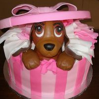 Lady From Lady And The Tramp Gift box is covered in Fondarific fondant, the puppy is rice krispy treats covered in fondarific. lid is gum paste.