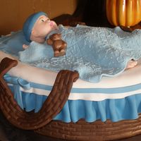 Moses Basket Baby is made out of fondant, White cake covered in fondant