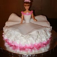 Ballerina I got the idea from Debbie Brown's book but instead of making a gumpaste doll I used a half Barbie.