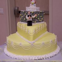 Romeo & Juliet Inspired Wedding Cake 16" Round Chocolate, 10" Triangle Yellow, 6" Square Spice all with cream cheese filling. Bottom two teirs are covered in...