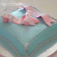 Shoe And Pillow Cake This is my first shoe and pillow cake.I wasn't able to shape the bottom of the pillow so may be next time.Overall i'm pretty...