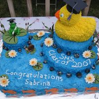 Duck Grad Cake My sister collects rubber duckies so I made her a duck graduation cake... complete with a pond! The sheet cake is half chocolate/half...