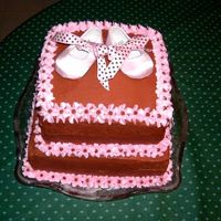 Chocolate Baby Shower Cake This was a baby shower cake and the mother-to-be wanted all chocolate so it was a very contemporary cake. It is all chocolate buttercream...