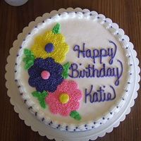 Flowers This was a simple flower birthday cake for my neighbor's daughter. I used a flower cookie cutter as the pattern and star tipped with #...