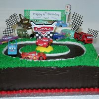 Disney Cars Racetrack I made this cake for my son's fourth birthday party (a Disney Cars theme, can you tell?). The cake is two layer 9x13, iced in dark...