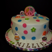 Hippy Chick 10in round yellow cake with buttercream icing. Royal icing accents