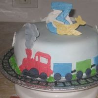 Train Cake 8" round chocolate cake with choc-mint filling. Covered in vanilla buttercream and homemade fondant. All hand-cut fondant details,...