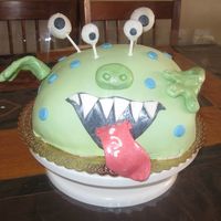 Monster Cake 10" round vanilla cake w/cookies and cream filling. Carved and covered in vanilla buttercream & homemade fondant. Fondant &...