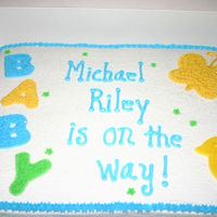 Baby Is On The Way! Half sheet cake with buttercream icing. Duck is made from fondant.
