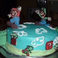 Matt's Mario Cake Carrot cake with cream cheese icing and filling. Characters are chocolate transfers.