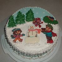 Winter Dora Birthday Cake Cake is iced in IMBC and the characters and trees are freehanded from candymelts. Thanks for looking!