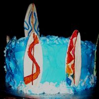121.jpg cake for daughters boyfriend/hes a surfer. boards make of gum paste. 2 of the boards are copies of the boards he owns.