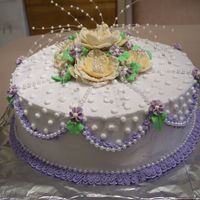 Birthday Cake All icing is buttercream. The flowers are made of fondant.