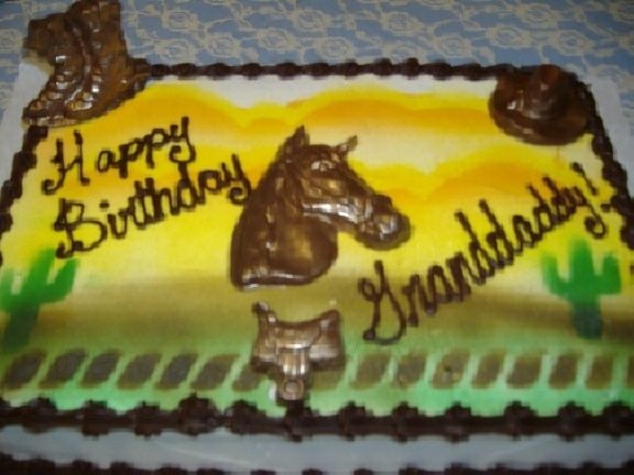 Western/horse Iced in buttercream and airbrushed. Horse, saddle , boots and hat all molded from chocolate candy melts. Iced with chocolate icing border