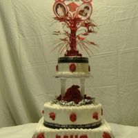 3 Tier Grad Cake Iced in buttercream icing Black graduation ribbon around cakes. All the gtraduation decorations were molded candy melts.