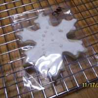 Snowflake Cookies Sugar cookies in snowflake cutouts with royal icing. TFL.