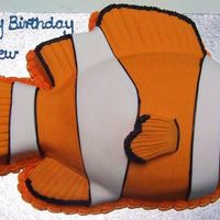 Nemo football tin and 6 inch square used to make all the fins, iced in fondant , choc mudcake