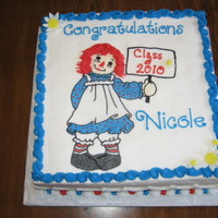 Nicole's Graduation This a 10 x 10 cake with a frozen buttercream transfer (with a couple of MMF flowers). The ragdoll is my neice's class mascot.