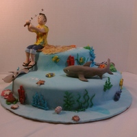 Gone Fishing All edible except fisherman and shark figures, I made them out of clay. This was for a friend's dad who was turning 60 and loves...