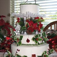 Img_1895.jpg This cake was for my aunt and uncles 25th wedding anniversary, where they where married again. They had a christmas theme. The cake is...