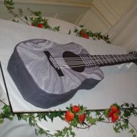 Guitar Groom's Cake Buttercake with BC filling, marblelized fondant and fondant/gumpaste. Strings are small threads of fondant press through a clay gun.