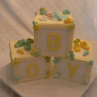Baby Boy Blocks Shower Cake This cake was for a friend of a friend. I'm so happy with how it turned out. Everything is edible including the baby, the baby booties...