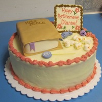 Retirement Cake done for a lady retiring. She loves reading the Bible, popcorn, candy, embroidery. . .