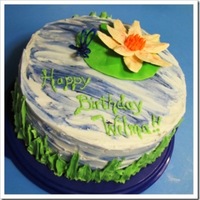 Waterlily Surprise Waterlily with rainbow cake inside. Both the water lily and dragonfly were made from candy melts.