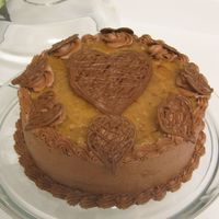 Husbands B-Day Cake German Choc. Cake / Mocha B/C frosting / carmal pecan filling and topping / milk choc. hand made hearts