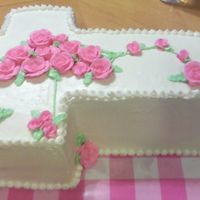 Cross Cake - 1St Communion - Girl Three layer white cake with butter cream frosting.