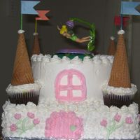 Castle / Tinkerbell 4th Birthday cake. 12 inch square white cake / 8 inch round chocolate. B/C frosting. Idea taken from the imagingation of my 4 yr old and...