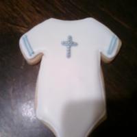 Onesie Royal icing and I used dragees on the cross. Its for my friends baby baptism. Tfl! :-)