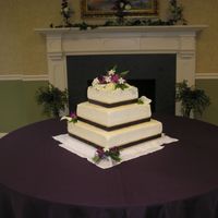 P1010054.jpg First wedding cake. Had a little issue with the florist. I was given flowers in a bucket and had to do the arranging myself. It was...