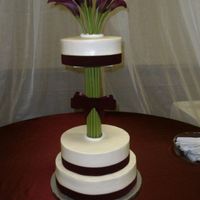 Wedding Cake My first actual wedding cake. Construction was a bit tricky, flowers are real, stems are fake. icing is all buttercream, with real ribbon...