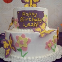 Butterfly Birthday Mr Banana Legs cake from Cake Love book, IMBC, candy melt butterflies & plaque, and fondant flowers