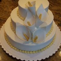 50Th Anniversary W/ Calla Lillies White cake w/ rasp filling and vanilla crusting buttercream. Gum pastecalla lillies. Thanks for the inspiration and permission to "...