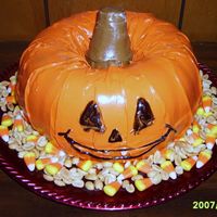 Pumpkin Cake This is just 2 Bundt Cakes placed on top of each other.... The stem is an ice cream cone covered in chocolate BC and the decorations around...
