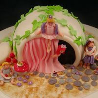 Princess Teapot Cake I made this cake for an auction for my daughters Softball league. The figures and food items are handmade from fondant/gumpaste. I used the...