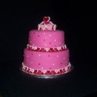 Happy Valentines Day!!! two tiered cake. 8x4 red velvet w/vanilla smbc and 6x4 chocolate with chocolate smbc. pink satin ice. wilton sugar hearts.