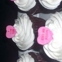 Cupcakes Chocolate cupcakes with vanilla frosting and a candy heart.For some reason i cant get the picture to upload correctly. sorry