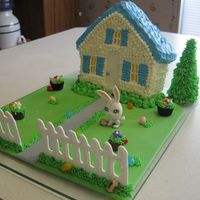 Easter Bunny Hiding Easter Eggs :) Used Wilton Stand up House pan. BC on house. Sugar ice cream cone with BC for tree. Flower pots are Reeses peanut butter cups with BC and...