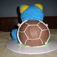Back Of 3D Blastoise Pokemon Turtle Cake This is the Back side of my 3D Blastoise Pokemon Turtle cake - Had to secure the shell some with wooden dowels - was afraid it would fall...