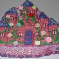 The Castle This is a chocolate fudge cake constructed with special castle-formed pan. The cake is frosted with cream cheese frosting. It is decorated...