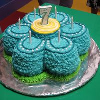 Flower Wilton Flower pan with the coolest colored tealish frosting I've even made: D