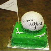 Buttercream Golf Ball This is a cake I did for a friends son. The ball and grass are all buttercream with fondent tees. Not the easiest cake I ever made.