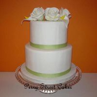 Simple Wedding Cake White gumpaste roses, while gumpaste calla lilies, ribbon. For a simple, classy, small wedding.